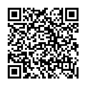 层层叠叠的木质房舍――这是一座颇有苗族风格的建筑二维码生成